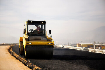 new asphalting road way worker driver machine 