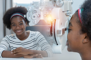 Double exposure image young woman african american eye exam with diagnostic ophthalmology in...