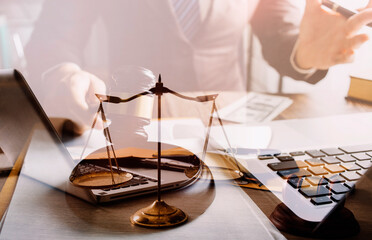 Male lawyer working with contract papers and wooden gavel on tabel in courtroom. justice and law ,attorney, court judge, concept.