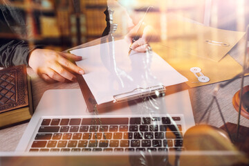 Male lawyer working with contract papers and wooden gavel on tabel in courtroom. justice and law ,attorney, court judge, concept.