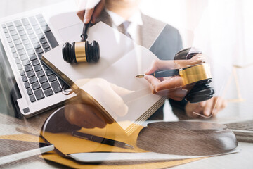 Male lawyer working with contract papers and wooden gavel on tabel in courtroom. justice and law ,attorney, court judge, concept.