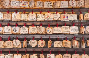 Rows of Ema prayer tablets at a temple in Japan