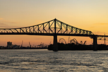 Fototapeta na wymiar Beautiful Sunrise in Old Port, clock tower and Jacques Cartier Bridge against sunset sky, Montreal, Canada