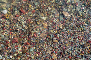 Colorful rocks and pebbles underwater at Glacier National Park Montana