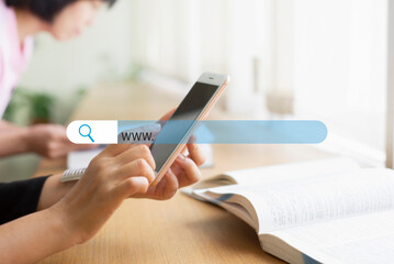 Close up on woman hands using smartphone with icon Searching for information on website