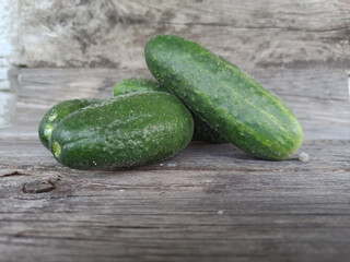 cucumbers shot on a wooden background - close-up
