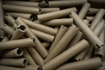 Special cardboard cores for winding paper and film tapes. Paper tubes for winding the products of printing houses. Cardboard tubes. Selective focus