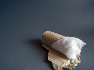 Cotton wrapped in paper isolated over gray background