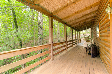 covered porch in the woods forest cabin mountains