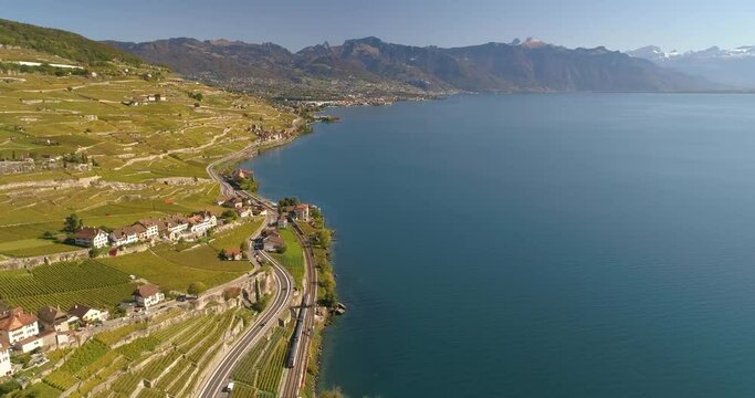Aerial drone bird's eye view video of sport boat rowing in beautiful switzerland lavaux region