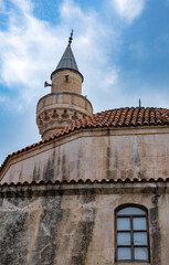 Fototapeta na wymiar historical hasanaga mosque. tile dome and minaret. Adana, Turkey.