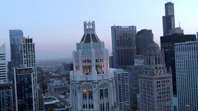 Aerial Backward Shot Of Famous Tribune Tower In Modern City - Chicago, Illinois