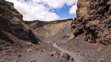 Giant caldera of Volcán del Cuervo volcano in Lanzarote, Spain, Canary Islands