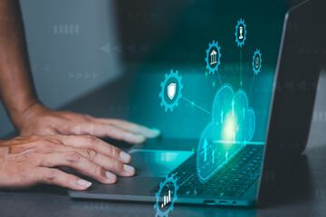 A young businessman uses cloud networking technology to communicate and connect data servers around the world. With the innovation of online internet from virtual screen through wireless