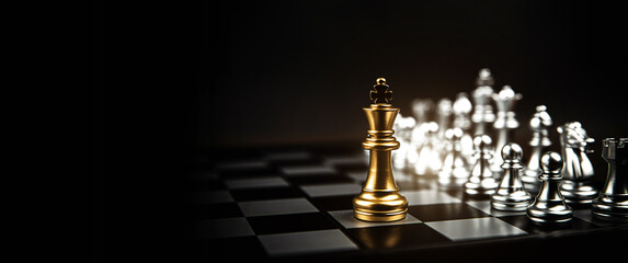 King chess stand on chessboard concepts of competition challenge of leader business team or...