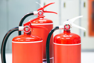 Fire extinguisher, Close-up red fire extinguishers tank in the building for fire equipment for extinguishing or protection and prevent for emergency and safety rescue and alarm system training.