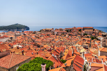 Medieval architecture in the walled city and the rugged coastline of Dubrovnik, Croatia with views of the Adriatic Sea