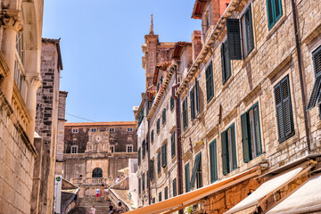 Medieval architecture in the walled city and the rugged coastline of Dubrovnik, Croatia with views of the Adriatic Sea