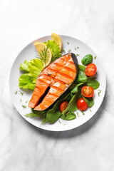 Grilled salmon steak with vegetable salad
