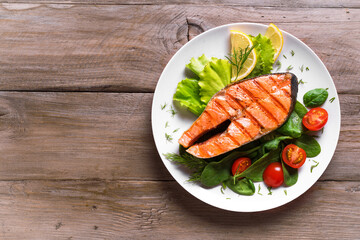 Grilled salmon steak with vegetable salad