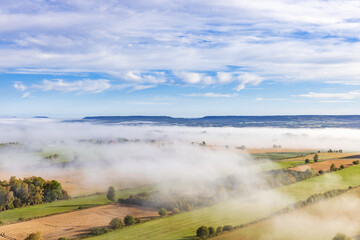 Fototapeta premium Aerial view at rural landscape with fog