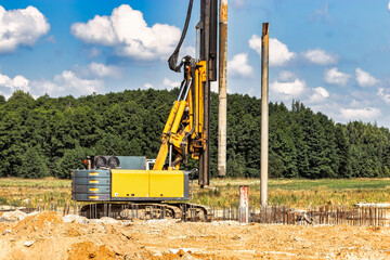 Powerful hydraulic drilling rig at a construction site. The device of pile foundations. Bored piles. Heavy construction equipment.