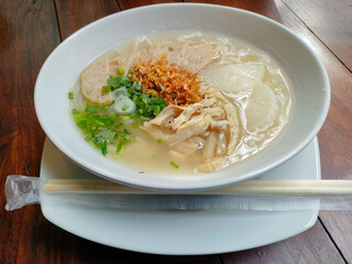 Focus of the Thick Rice Noodle Soup with Vietnamese Sausage is a delicious breakfast in Thailand.