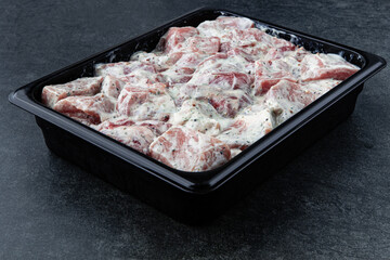 Raw pieces of meat shish kebab in marinade with pepper, onion, ready to cook, barbecue meat