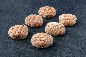 Frozen meat dumplings on gray stone background