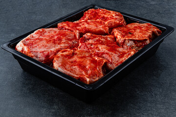 Raw pieces of meat shish kebab in marinade with pepper, onion, ready to cook, barbecue meat