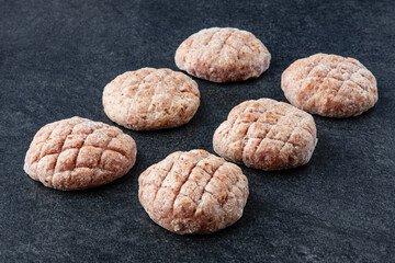 Frozen meat dumplings on gray stone background