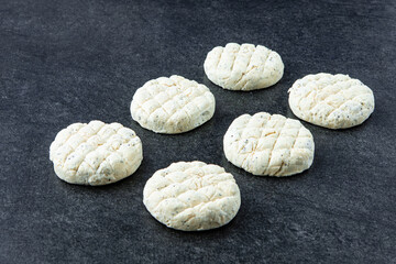 Frozen meat dumplings on gray stone background