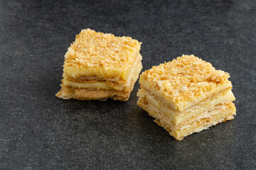 delicious Napoleon cake on stone table