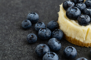 Close-up view of Blueberry cheesecake on stone background