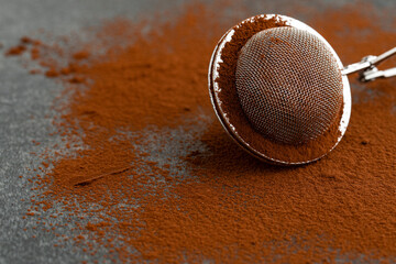 cocoa powder on dark stone background