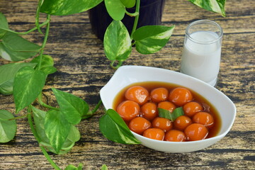 Bubur Biji Salak, Indonesian dessert porridge of sweet potato balls with coconut milk. A popular food for breaking the fast during Ramadan.