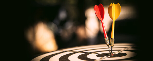 Bullseye target goal or dartboard has dart arrow throw hitting center shooting for financial...