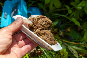 hand with clogged filter