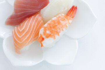 Fours pieces of sushi on small plate for Japanese food image