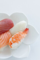 Fours pieces of sushi on small plate for Japanese food image
