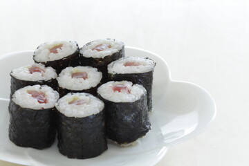 Japanese food, tuna fish roll sushi on dish 