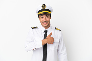 Airplane pilot over isolated white background giving a thumbs up gesture © luismolinero