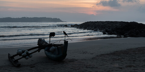 Fishing boat on the morning beach