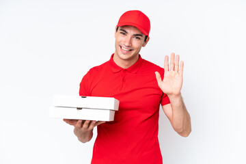 Pizza delivery caucasian man with work uniform picking up pizza boxes isolated on white background...