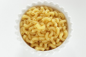 Dried Italian pasta, macaroni in bowl for dried food ingredient