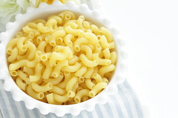 Dried Italian pasta, macaroni in bowl for dried food ingredient