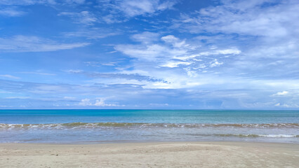 View of sea, beach, blue sky and white clouds