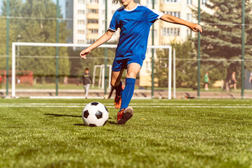 gerl soccer player kicking ball