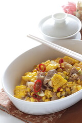 Chinese food, summer sweet corn and pork stir fried with Chili pepper