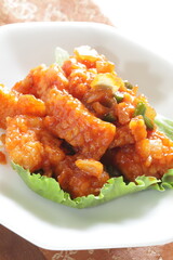 Homemade squid and sweet chili sauce on lettuce for Chinese comfort food